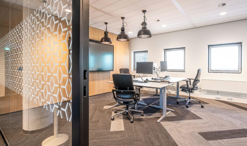 Spacious and contemporary office space with modern furnishings and sleek design elements.